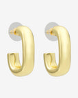Gold hoop earrings on a white background