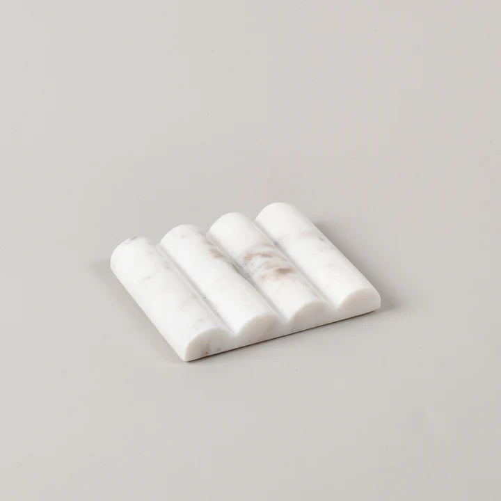 The white marble scalloped soap dish is Ideal for displaying your favourite bathroom hand soap bars. It has a beautiful groove design that gives it a stylish appearance.