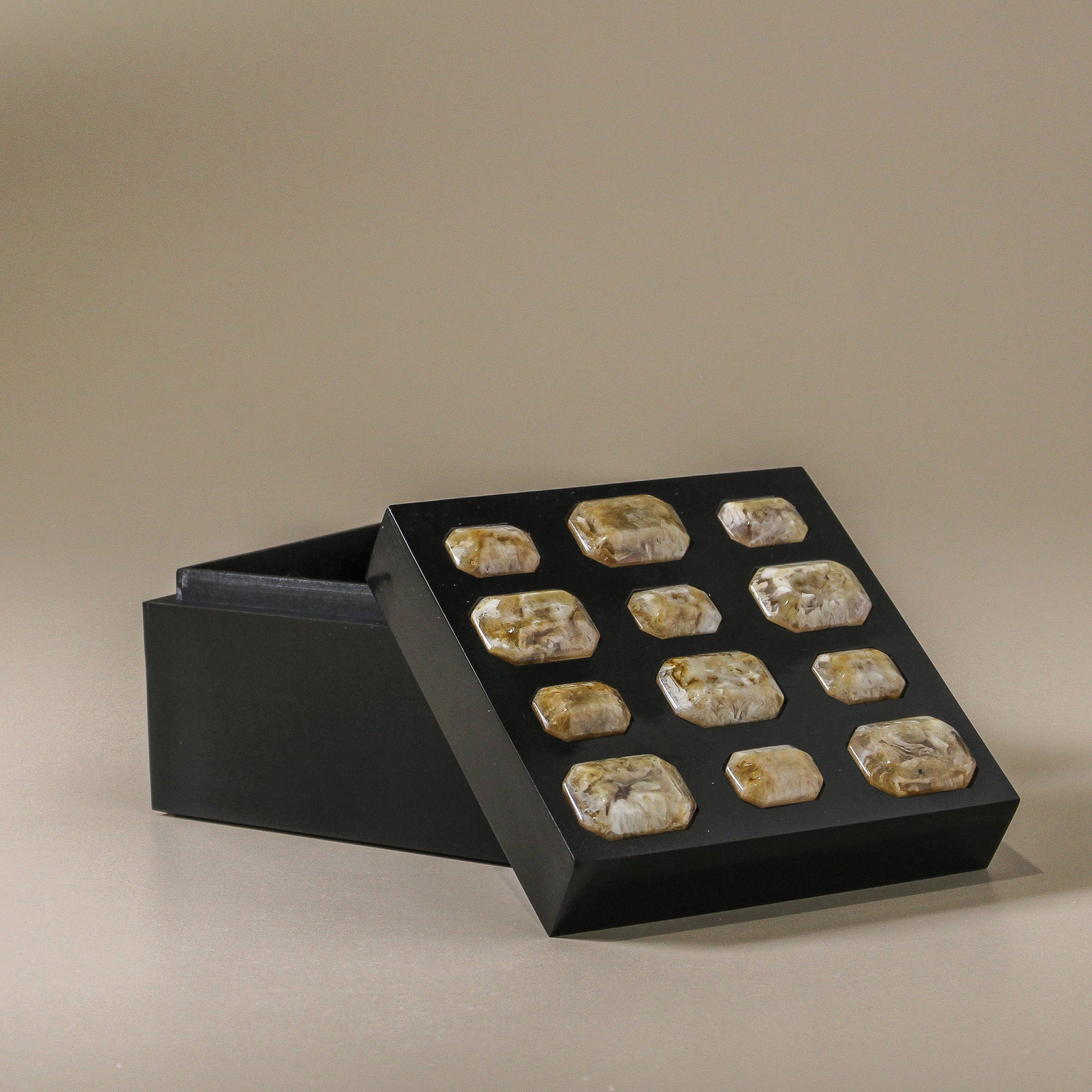 Black jewelry box with embedded stones 