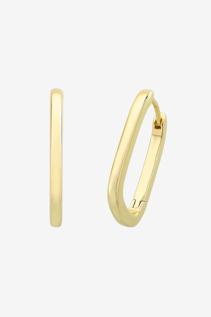 Gold hoop earrings on a light gray background