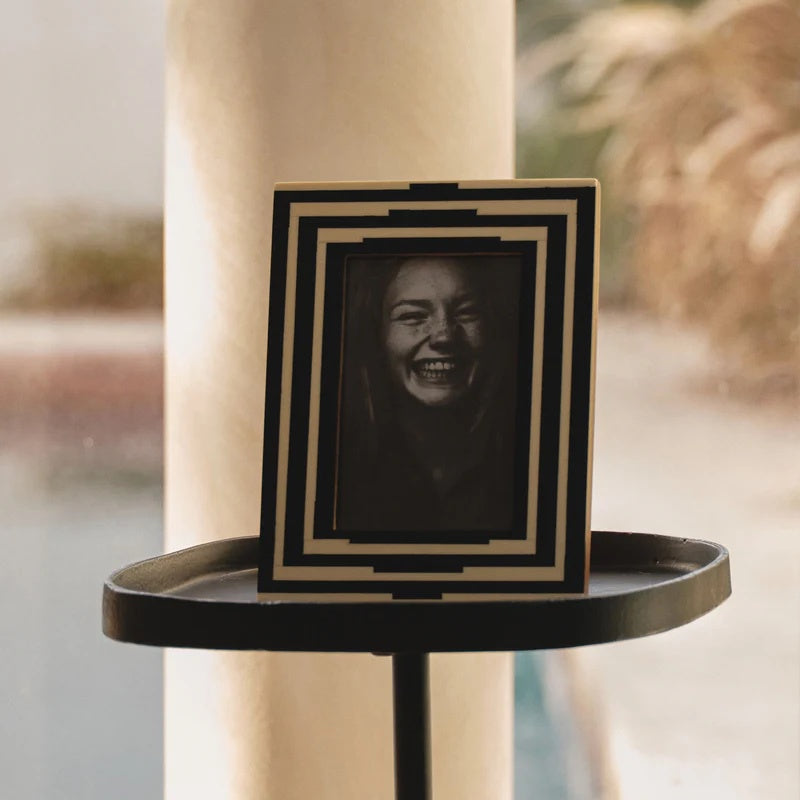 Black and white photo frame featuring a geometric pattern in an art deco style