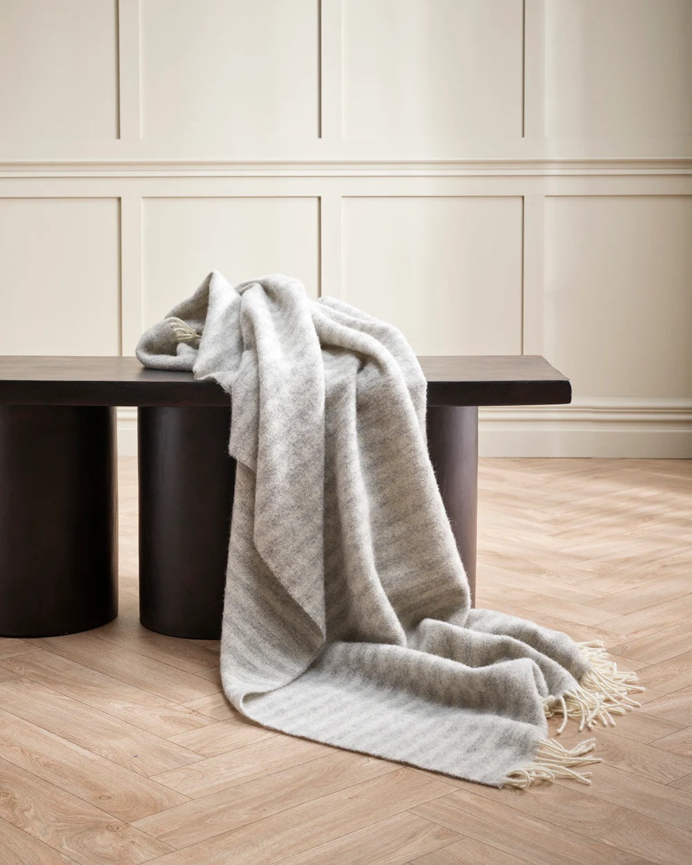 striped silver blanket with white fringe
