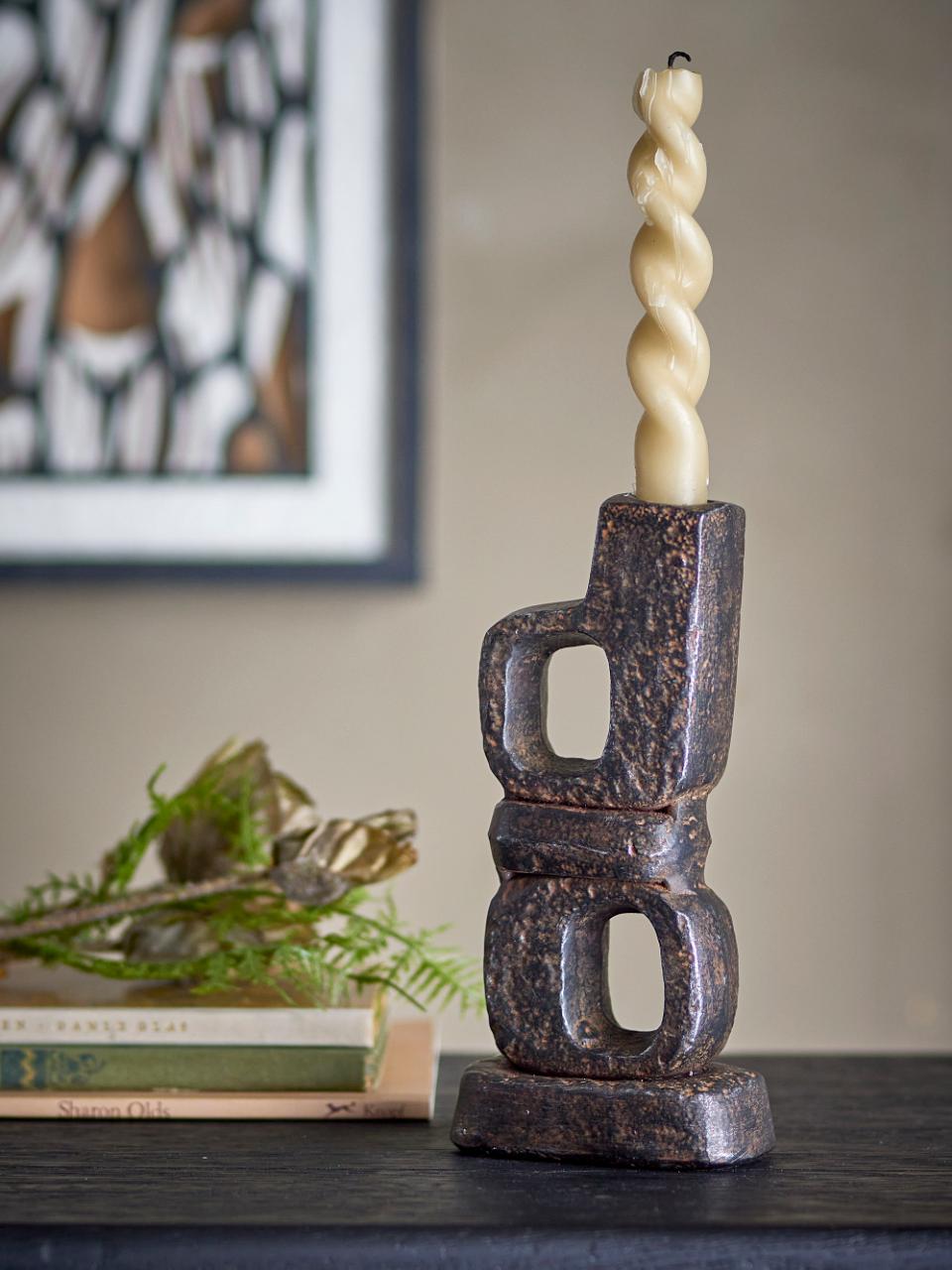 Decorative candle holder made from cast iron.