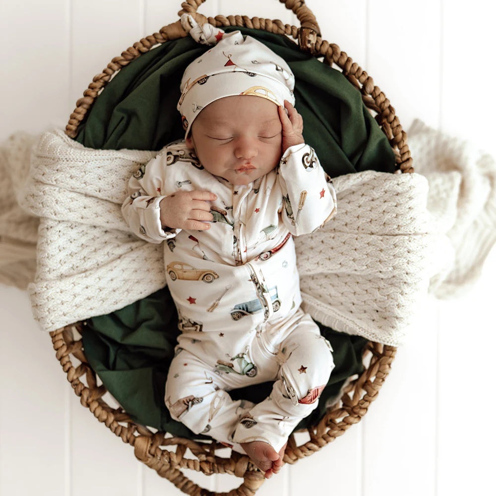 Baby romper featuring vintage car print design