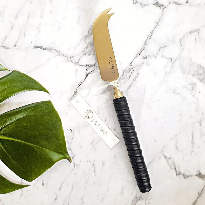 Clinq Brass leather cheese knife